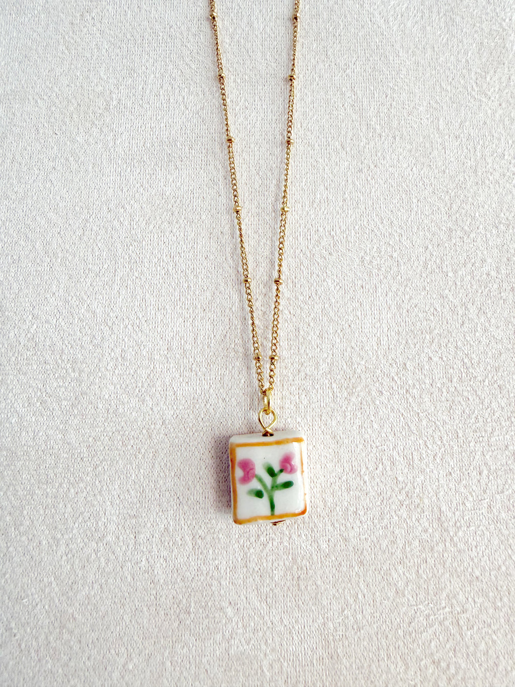Cadena acero con florecitas en cerámica 🌷
