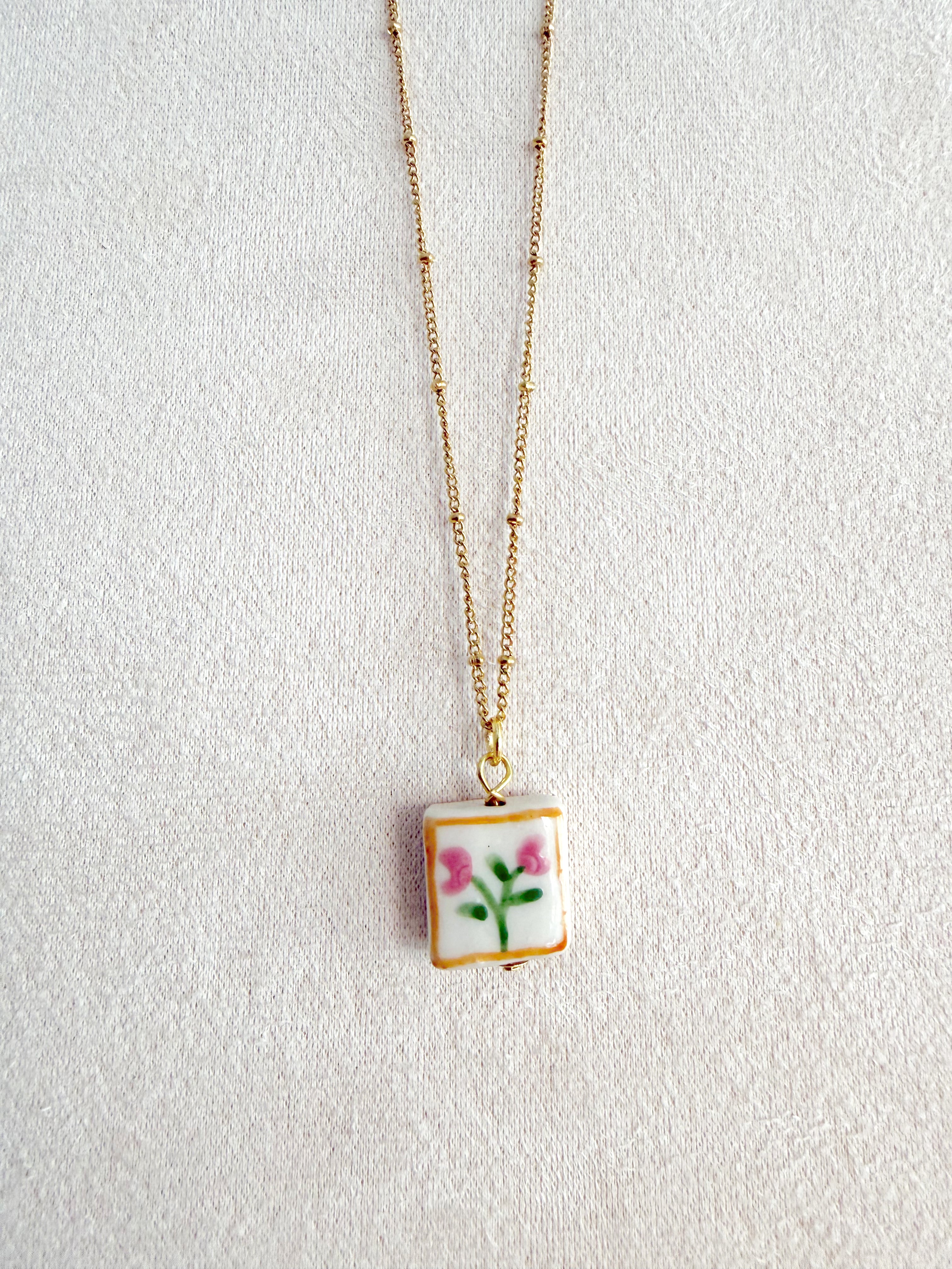 Cadena acero con florecitas en cerámica 🌷