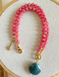Naranja, fucsia y concha de mar