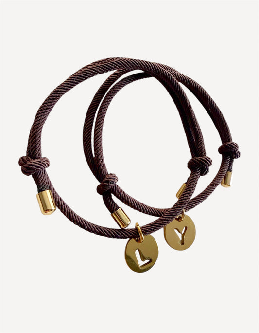 Pulseras protección + inicial