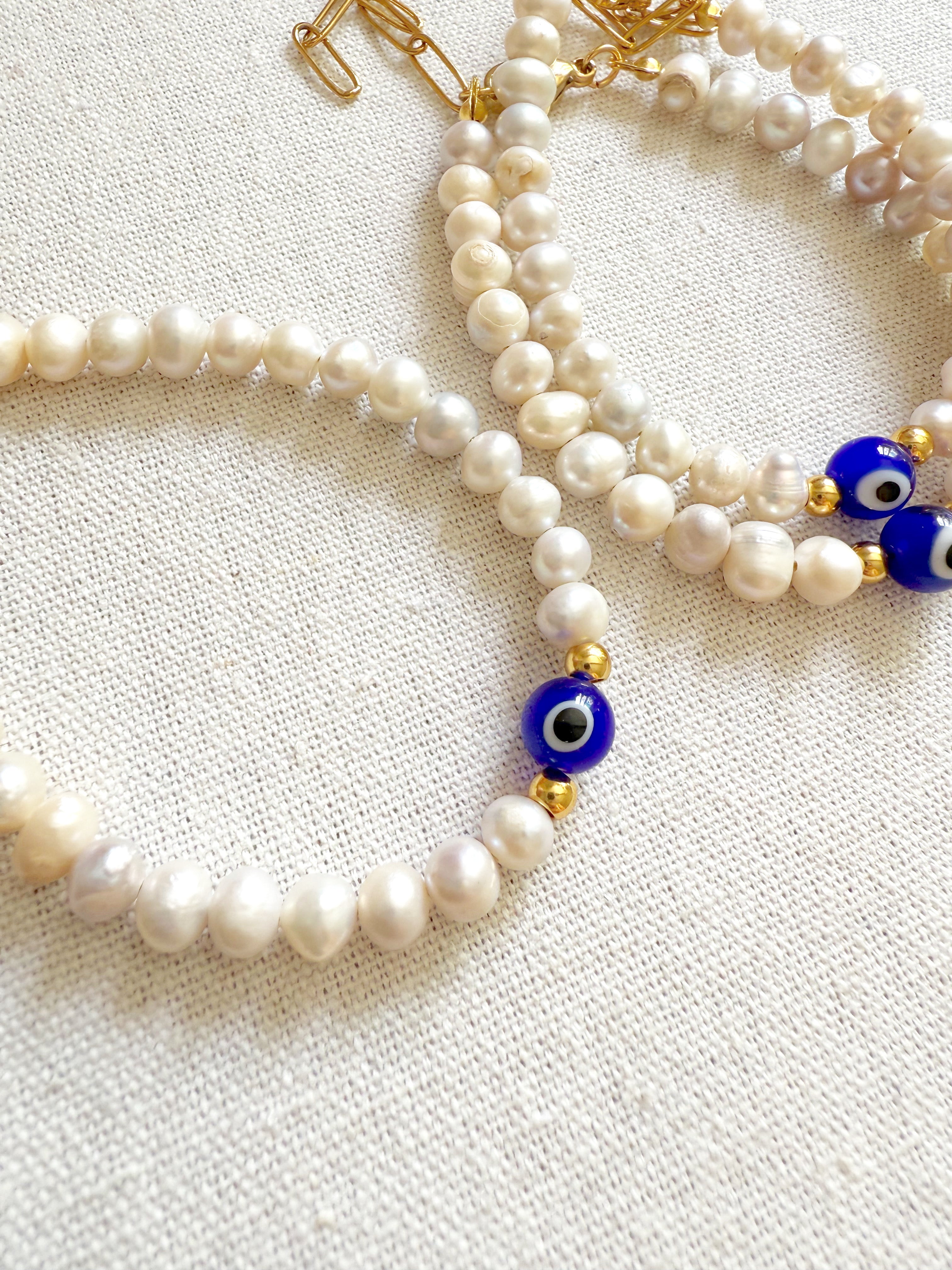 Pulsera perlas con ojo turco