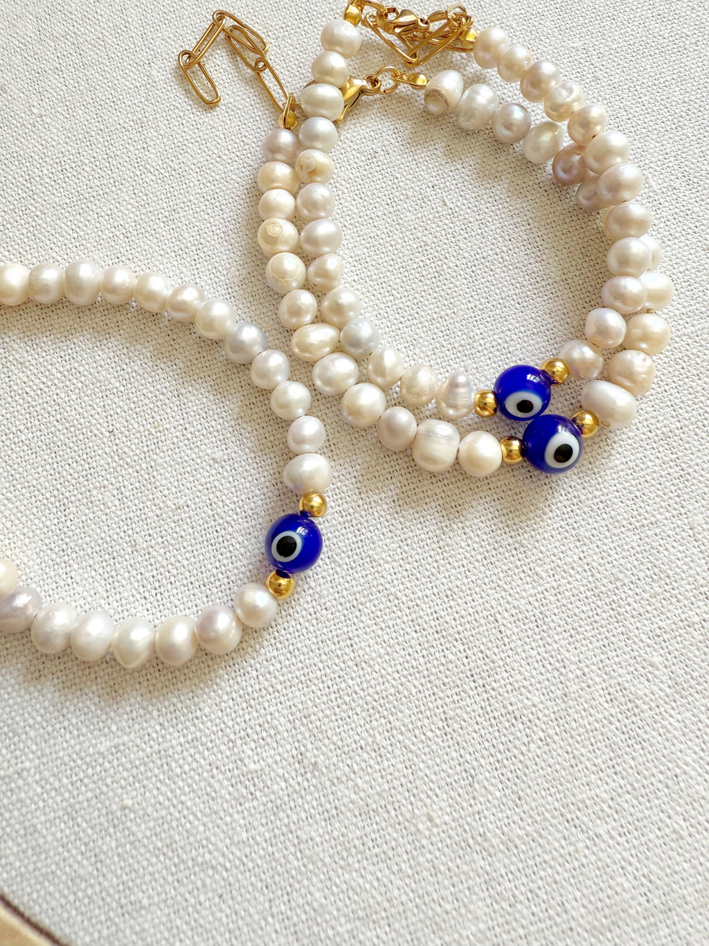 Pulsera perlas con ojo turco